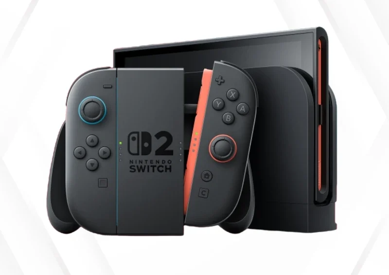 Nintendo Switch 2 konsol med mørke controllere med blå og orange detaljer i docken
